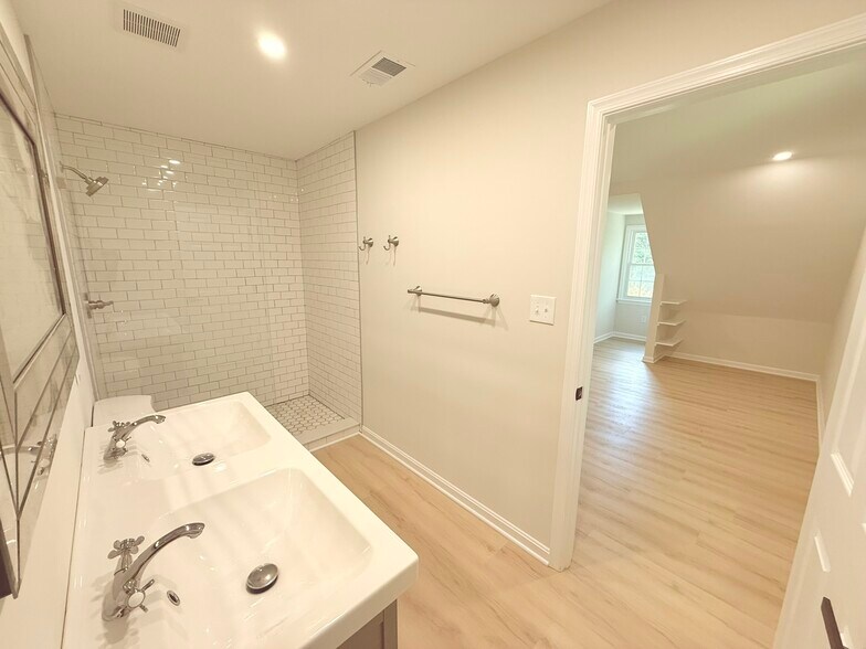 Upstairs primary bathroom - 9248 Wood Glade Dr