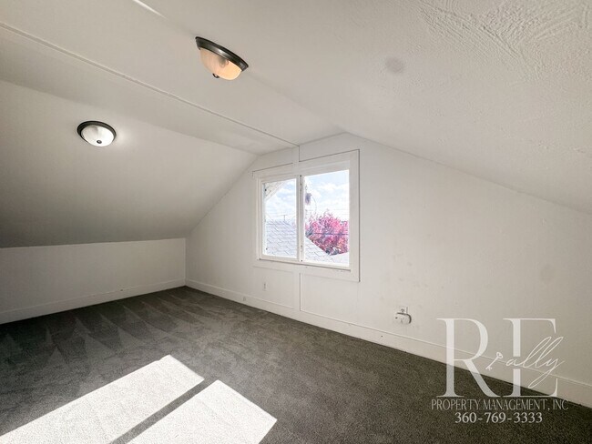Building Photo - Light-Filled Home with Vaulted Ceilings, Bonus Basement & Walkable Location