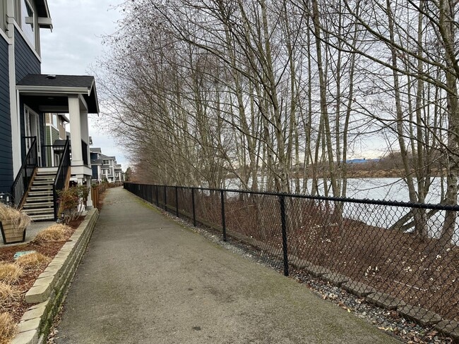 Building Photo - Riverfront Townhome with Tandem Garage & Fenced Yard