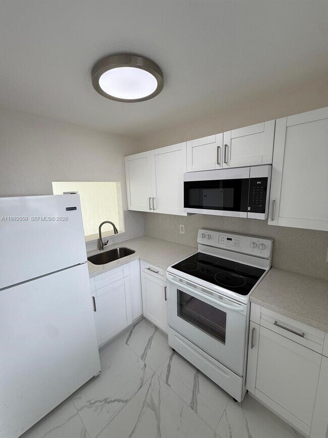 Building Photo - 4298 NW S Tamiami Canal Dr