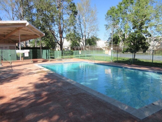 Building Photo - Duggan Property Management, Inc presents  *Reduced*  Canoga Park- 3BD 2.5BA