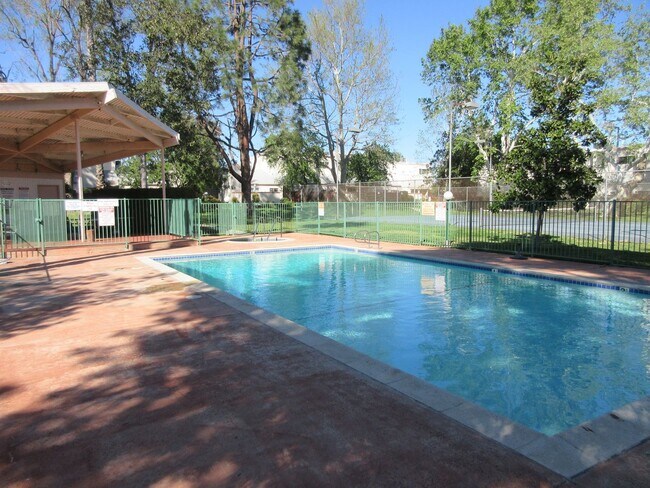 Building Photo - Duggan Property Management, Inc presents  *Reduced*  Canoga Park- 3BD 2.5BA