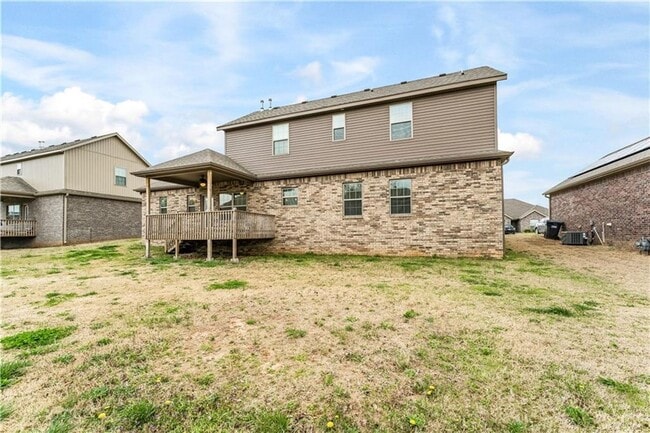 Building Photo - Minutes from I-49! 4BR/2.5BA Home