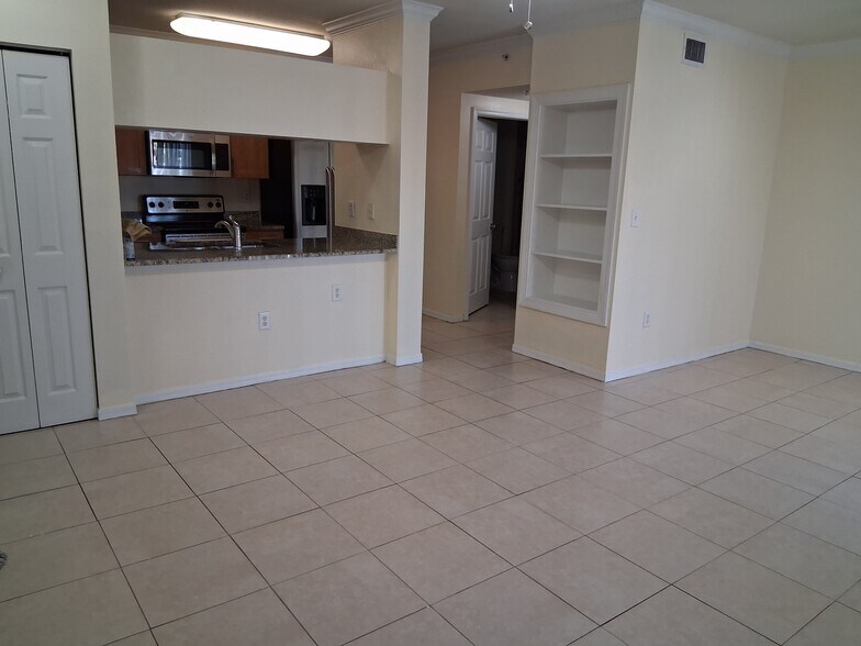 Living room view of kitchen - 6482 Emerald Dunes Dr