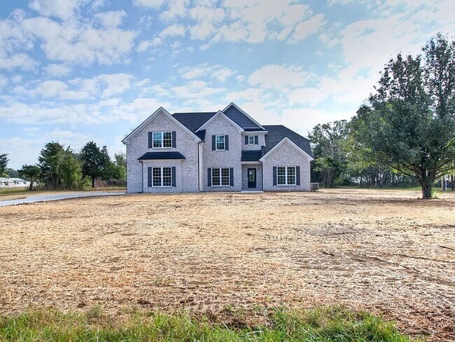 Building Photo - Situated on over 3 acres right in a growin...