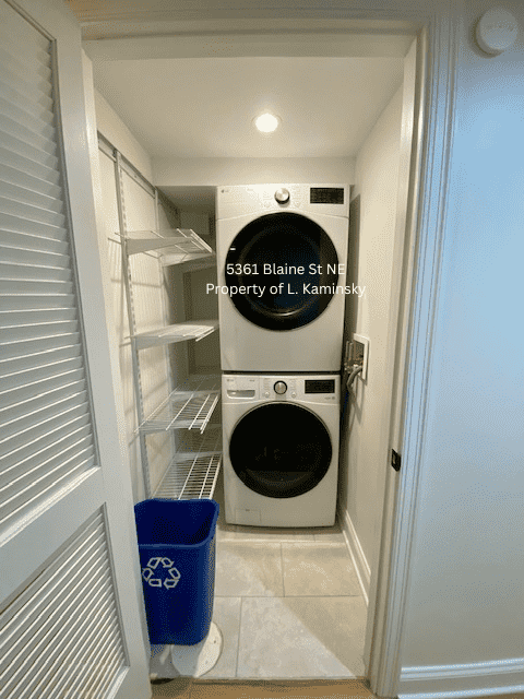 Stacked, full size washer/dryer with shelving for pantry items/storage - 5361 Blaine St NE