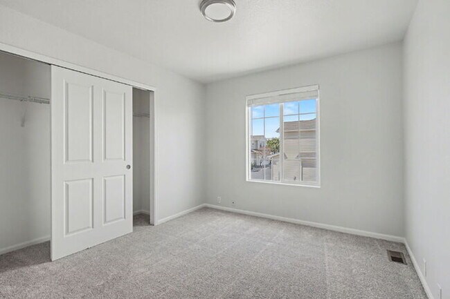 Building Photo - Beautifully Updated 3-Bedroom End-Unit Townhome Facing Open Space with Attached 2-Car Garage in G...
