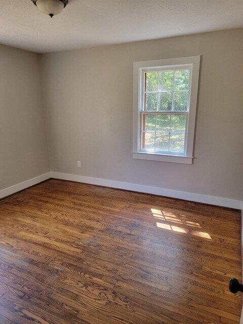 Building Photo - "Charming 3-Bed Retreat with Gleaming Hard...