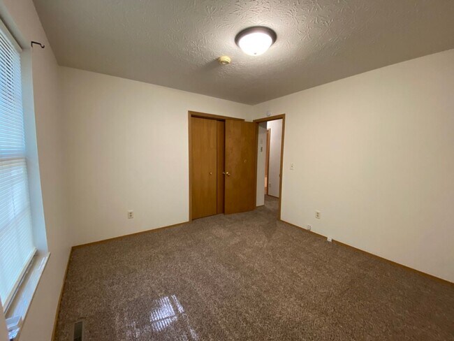 Building Photo - Three bedroom, two bathroom, two car garag...