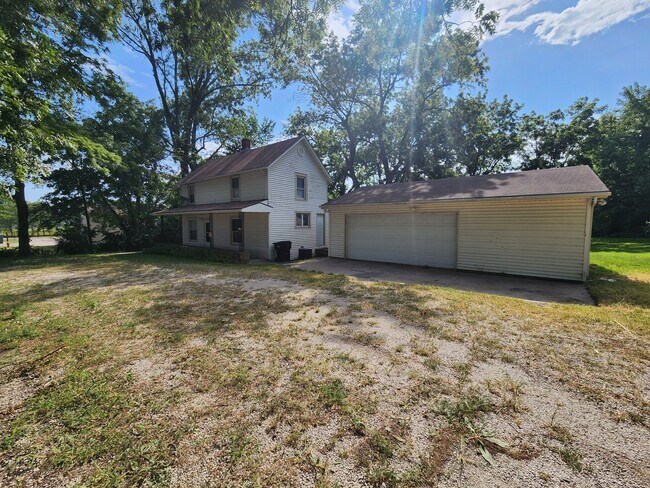 Building Photo - Nice home with oversized 2car gar with work bench and large shaded yard. Country-like setting