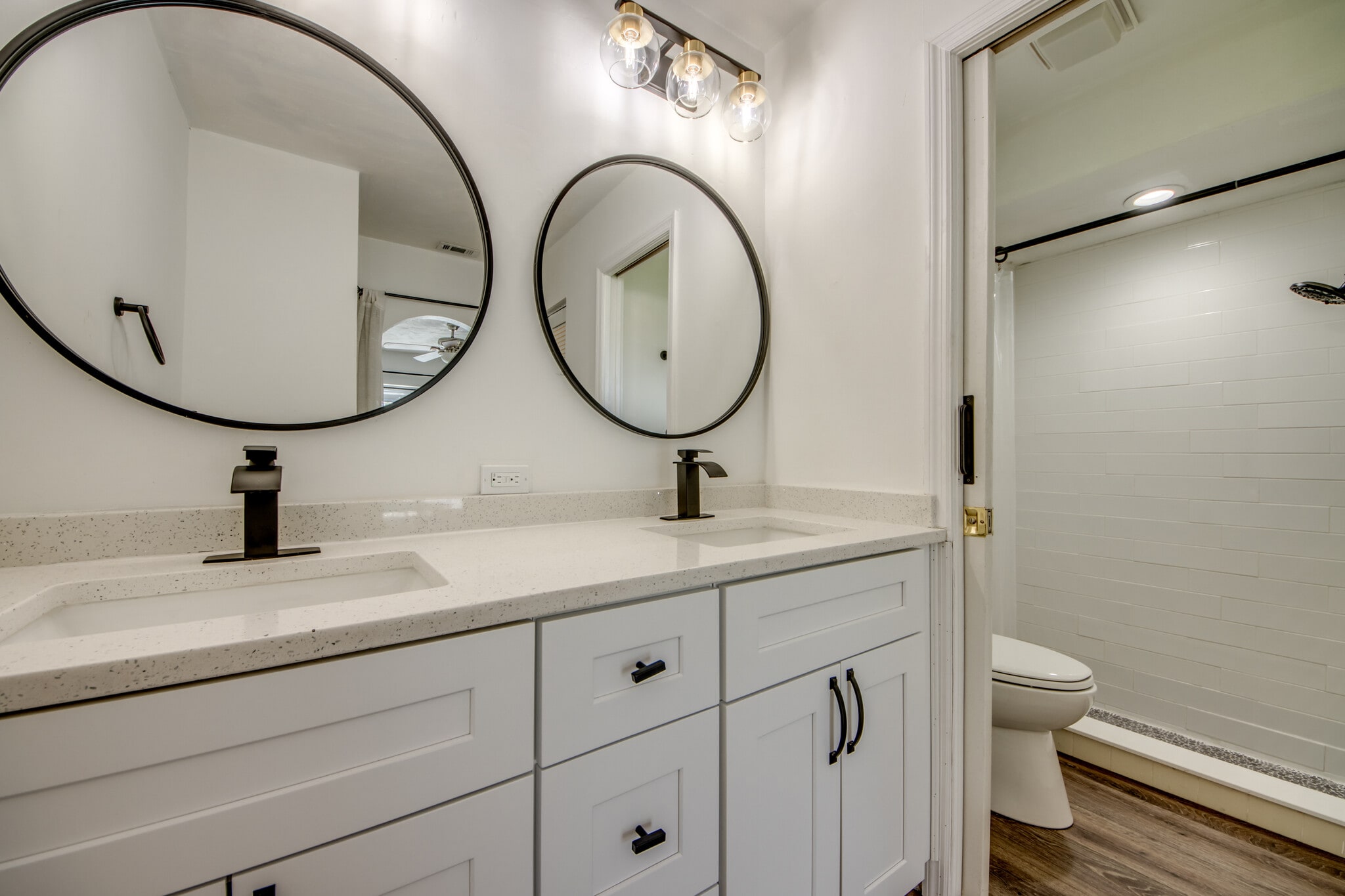 Updated Primary bath with dual sinks, designer fixtures and new subway tile shower. - 2316 Everest Pky