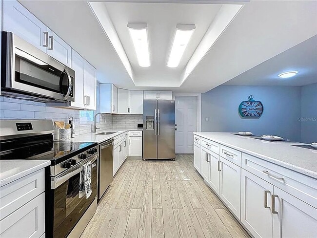 Building Photo - Modern luxury meets Florida charm in this ...