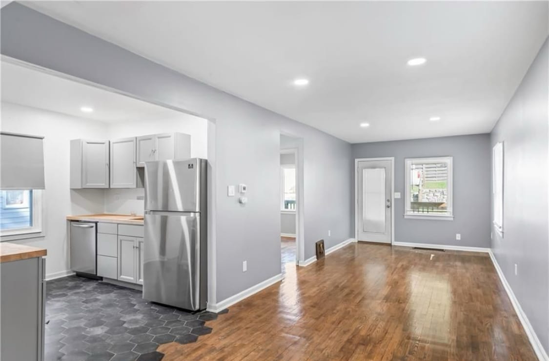 View of open kitchen and living room. Dishwasher appliance also noted - 600 Ridgeview Ave