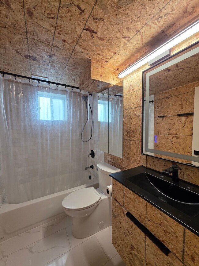 Building Photo - Charming 2BR with Walk-Out Basement, Fenced Yard & Flexible Murphy-Bed Office