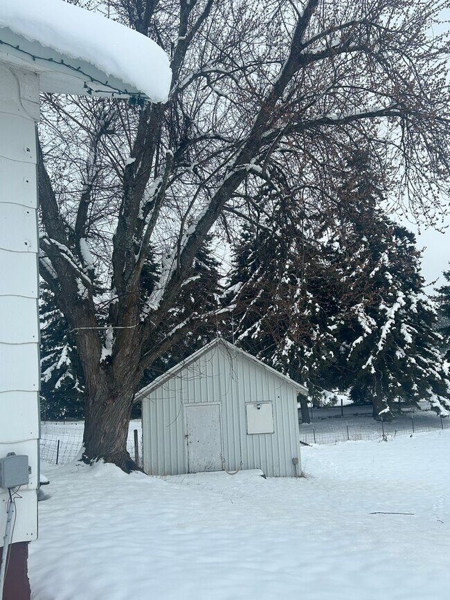 Building Photo - Bigfork Rodeo Farmhouse~ Fenced garden, greenhouse, garage, barn and shop!