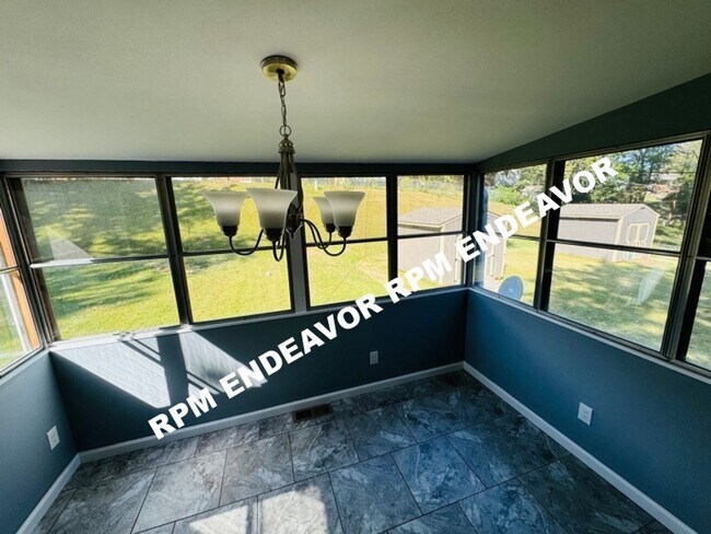 Building Photo - "Charming 4-Bedroom Haven with Sunroom, Ha...