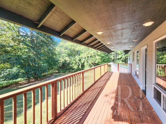 Building Photo - Vaulted Ceilings, Unique Designer Kitchen & Expansive Half-Acre Setting with Flexible Living Spaces