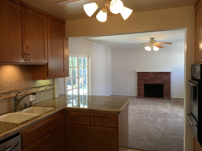 Kitchen opens to Family Room with Fireplace - 7823 Midfield Ave