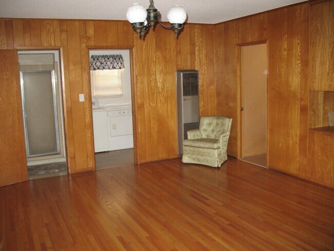 Gigantic Wood paneled bedroom with oak hardwood floors - 3121 W Wyoming Ave