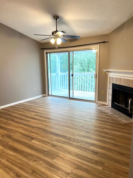 Living room with fireplace and balcony - 7680 Scioto Ct