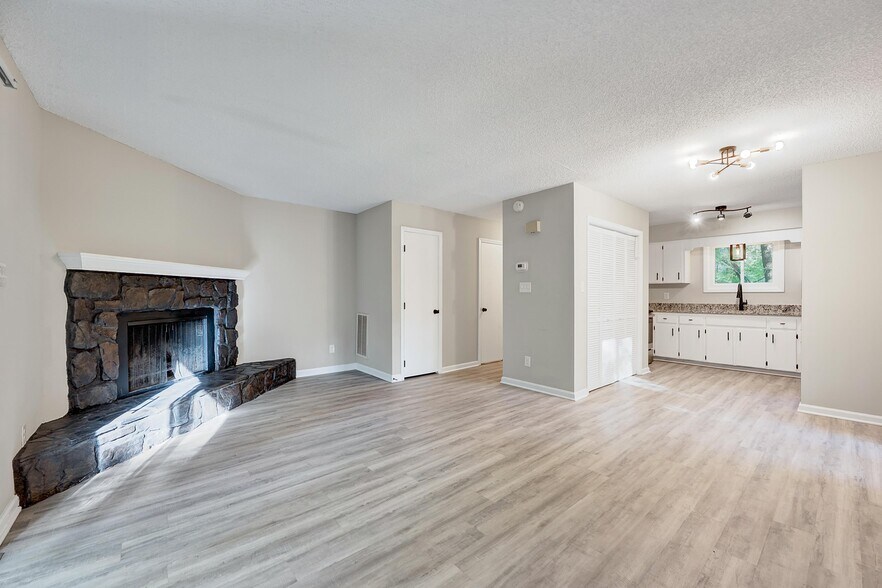 Open to the kitchen and dining space as well - 4115 Arckelton Dr