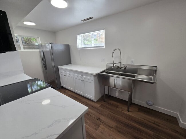 Building Photo - Remodeled 4 Bed, 2 Bath with Double Kitchen & Covered Carport