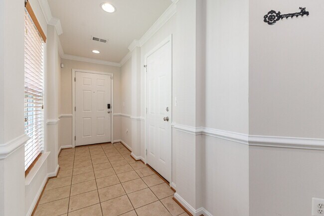 Building Photo - This beautiful townhouse has everything you need in a dream home.