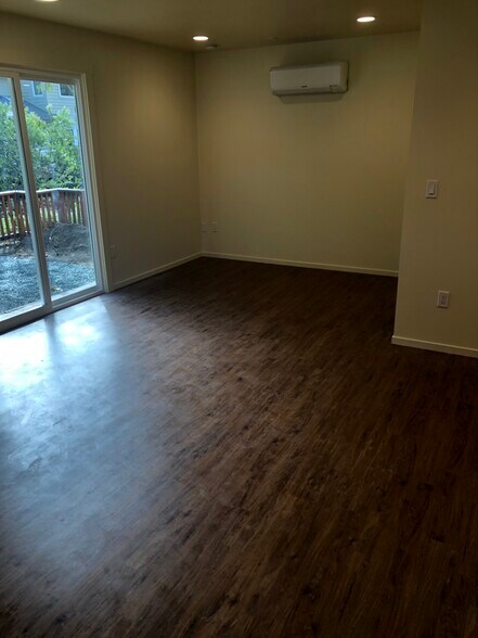 Easy-to-maintain luxury vinyl plank flooring in neutral wood color. - 2362 Meadow st