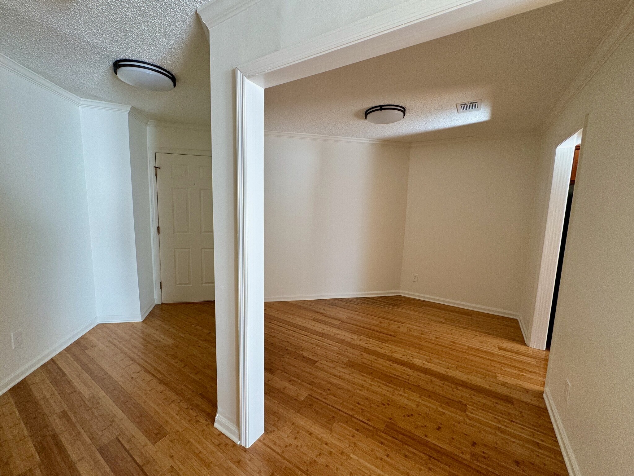 front entry hall and door at left, office/bonus room at right - 209 14th St. NE #119