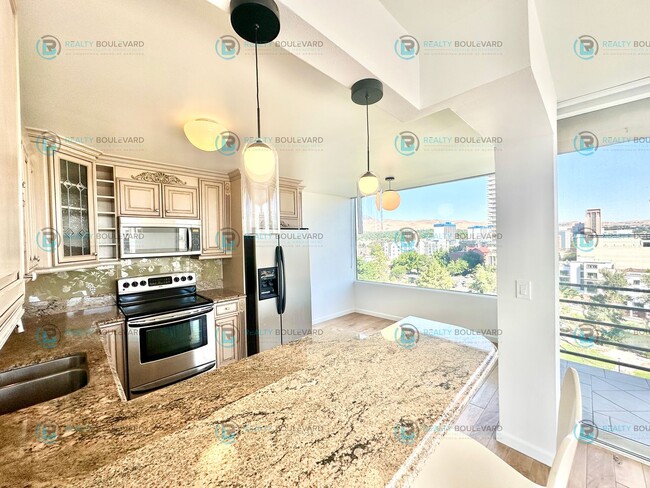 Building Photo - Exquisite 1-bedroom, 2-bathroom condo Overlooking the beautiful Truckee River with covered parking!