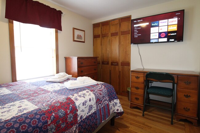 Full bedroom with smart Roku TV - 11 Columbia St