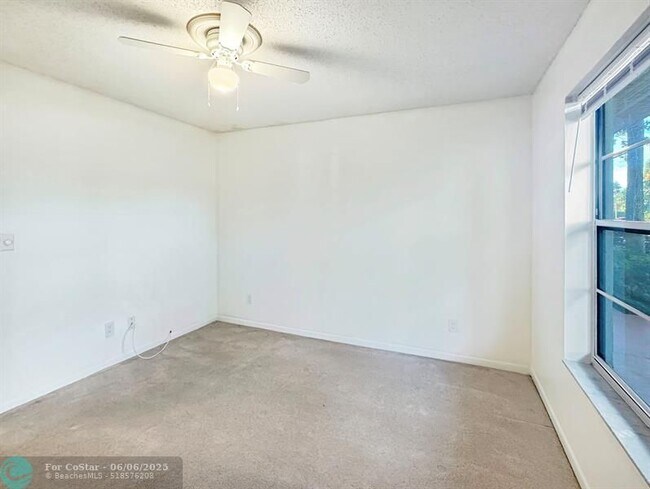 Building Photo - 6090 N Sabal Palm Blvd