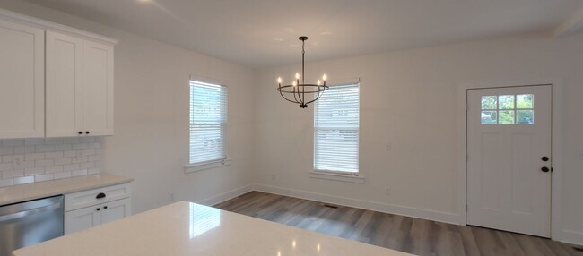 Building Photo - 5-bedroom home with 3 car garage and fully...