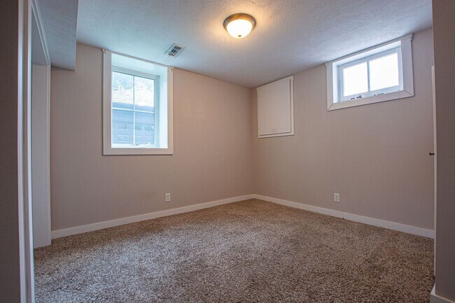 Building Photo - Adorable Brick 4 Bedroom Ranch with Finish...