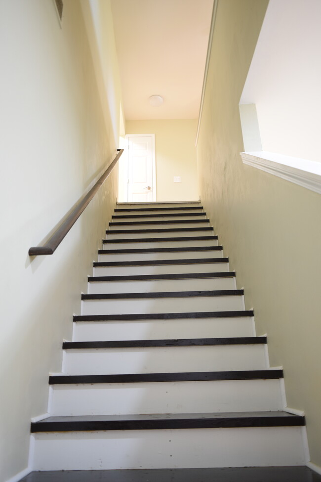 Stair way to upper level bedrooms and bathroom. - 381 Ferry Ave