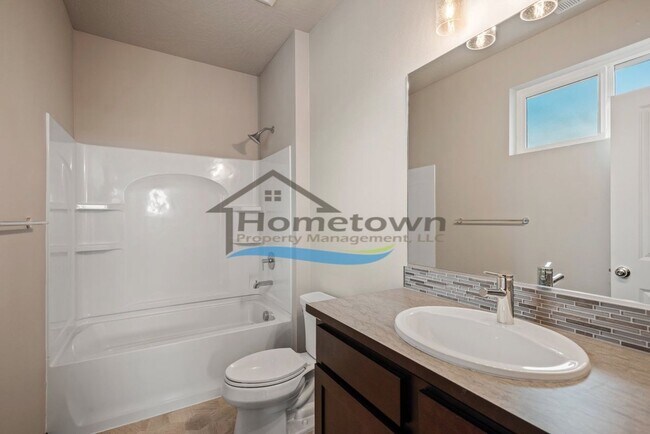 Building Photo - Woodbridge South Home with 4 Bedrooms and 3 Bathrooms in Post Falls build in 2021!