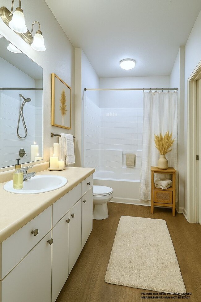 Building Photo - 2x2 New flooring throughout! Updated, spacious, bright and comfortable with balconette!