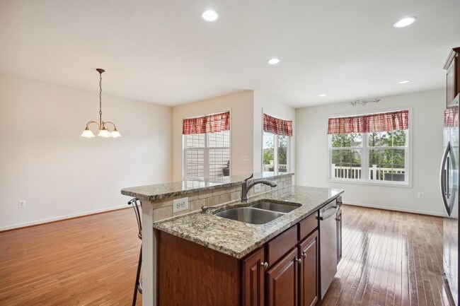 Building Photo - This beautiful townhome spans three finished levels and over 2800 square feet.