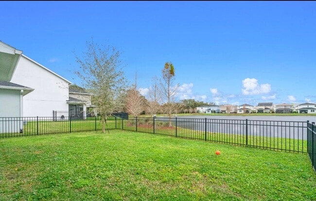 Building Photo - Water Front Home- 4 Large Bedrooms-3 baths Gated Community Call Sheila Campbell 407-687-7900