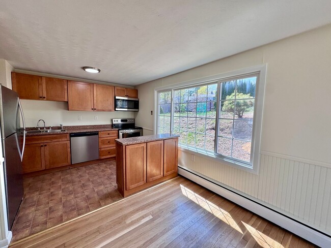 Primary Photo - Spacious, sun-filled living with a backyar...