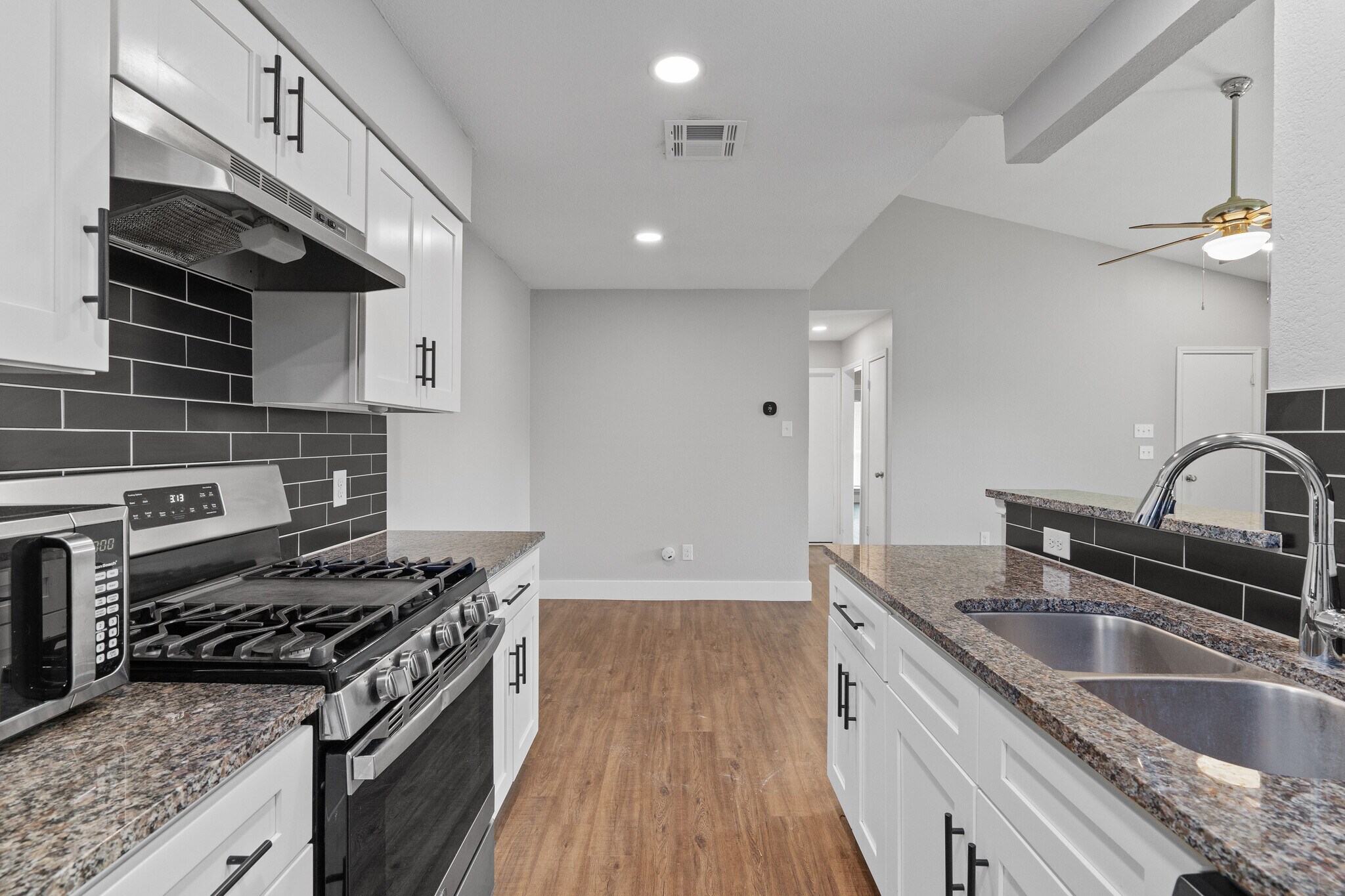 Kitchen from w/d hookups and back door. - 602 Peterson St