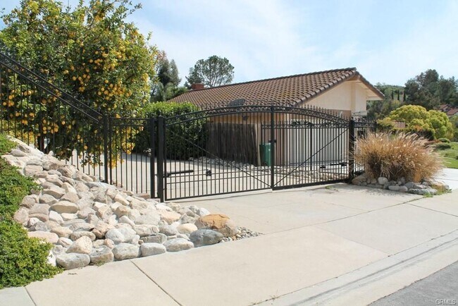 Building Photo - This incredible 4 bedroom single level home with private GATE  entry