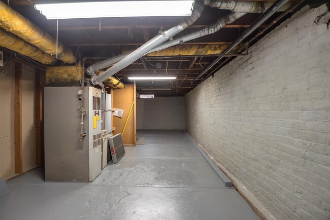 On the other side of the finished basement side is the other half which is newly painted. - 2108 E 23rd St