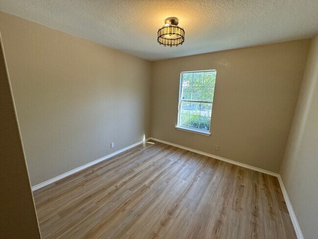 Building Photo - NEW PAINT, FLOORING, APPLIANCES & ROOF  | ...