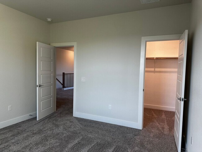 Building Photo - For Lease – Modern 2023 Condo Backing to Greenbelt | Creekside at Pioneer Crossing West