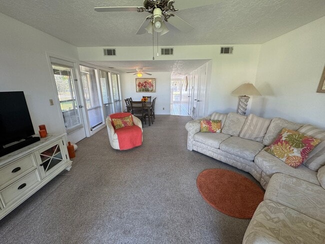 Building Photo - FULLY FURNISHED 2-Story Townhouse on Canal – Pool, Golf Views & ALL Utilities Included!