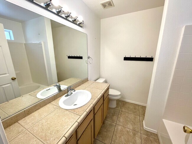 Building Photo - Inviting 3 Bedroom Home with RV Parking an...