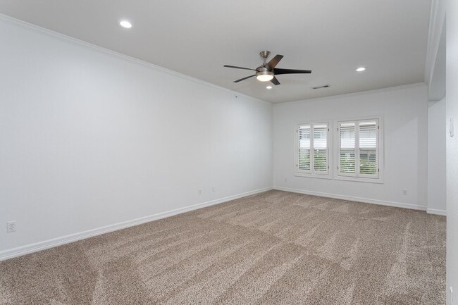 Building Photo - Gorgeous Mediterranean-style condo located...