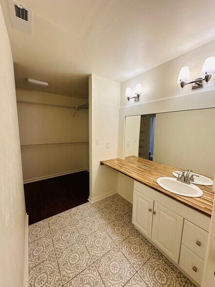 Master vanity attached to master closet . See video - 703 Idlewood Ln