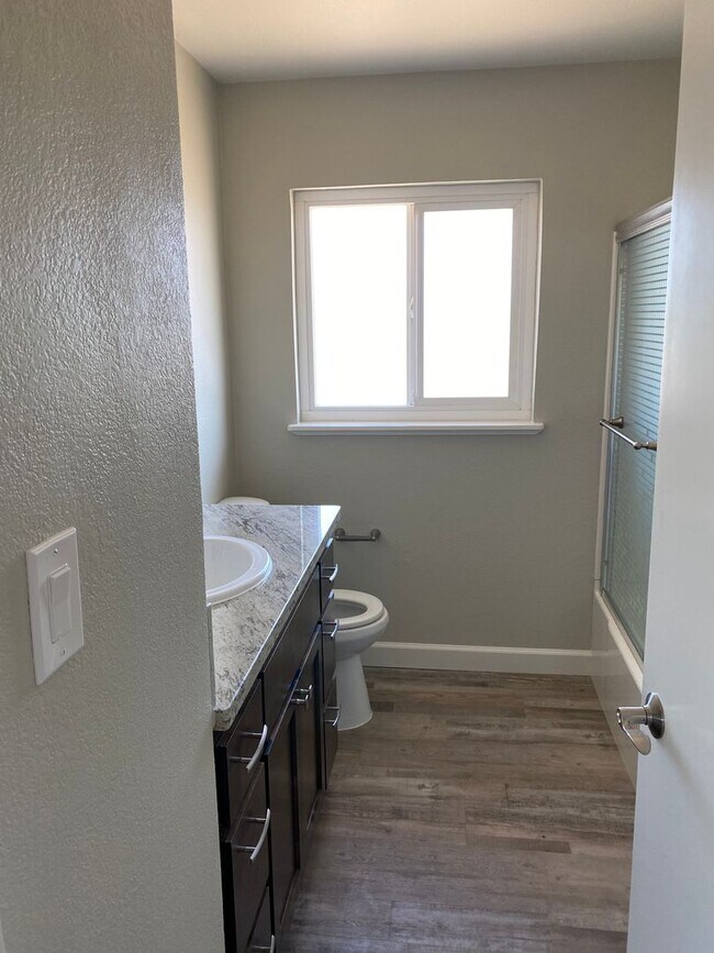 Building Photo - A Welcoming 3-Bedroom with Outdoor Room to Breathe